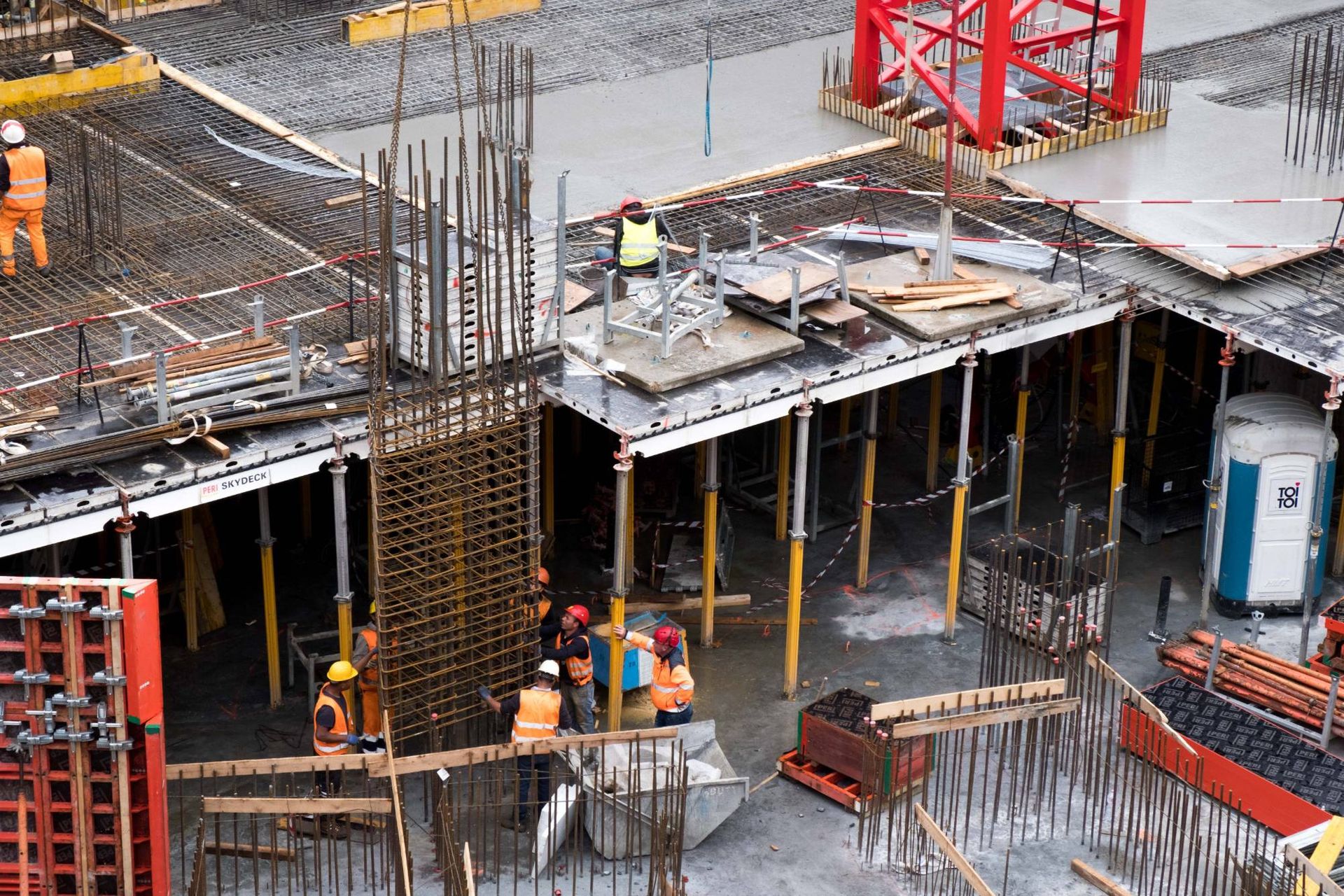 Workers building reinforced concrete structure